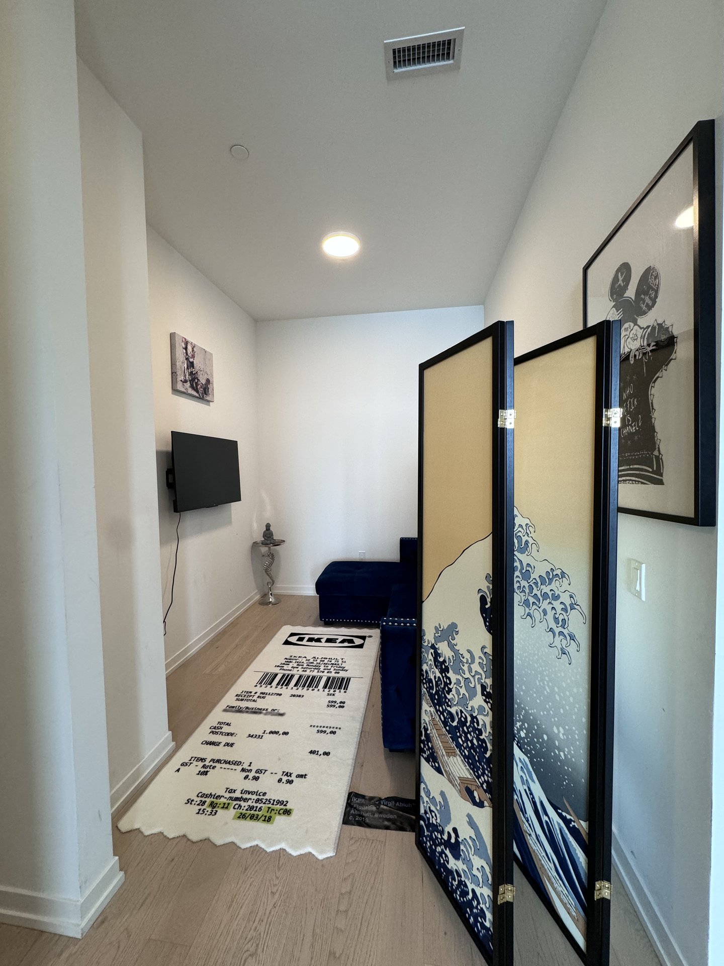 Hallway with Virgil Abloh art and Hokusai screen